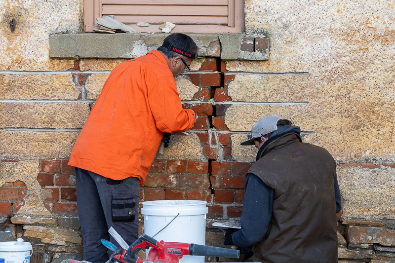 Inserting stitching bars in a brick wall at historic Woolmers Estate